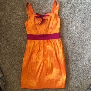 Orange vintage party dress with gorgeous bow detail in back. Dress size 00-2